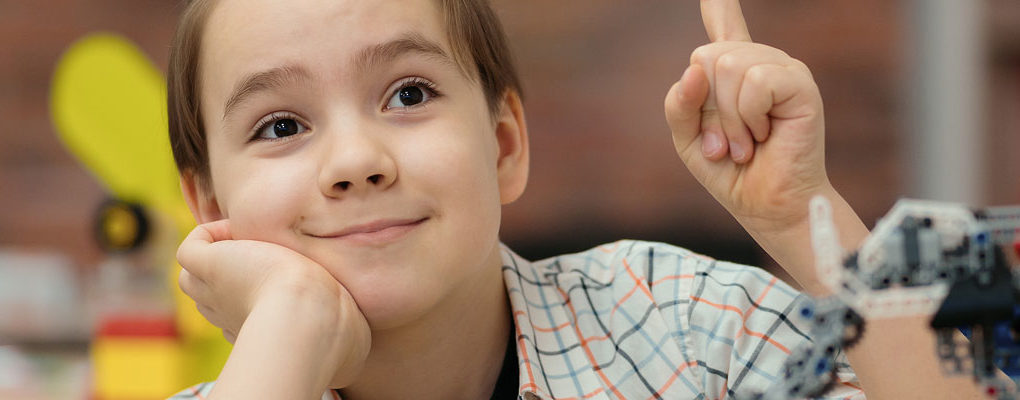 boy raising his hand